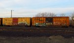 Two TTX boxcars, in different schemes